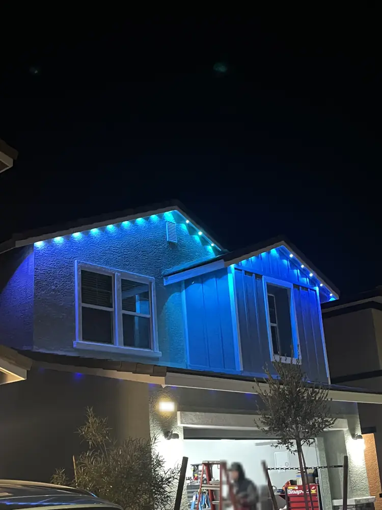 Permanent eave lighting in blue along the roofline and gable, Las Vegas